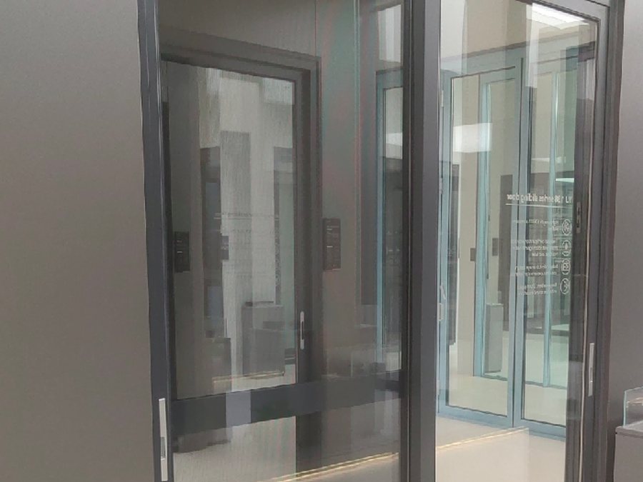 Full-size pivot door sample displayed in the Bishkek showroom