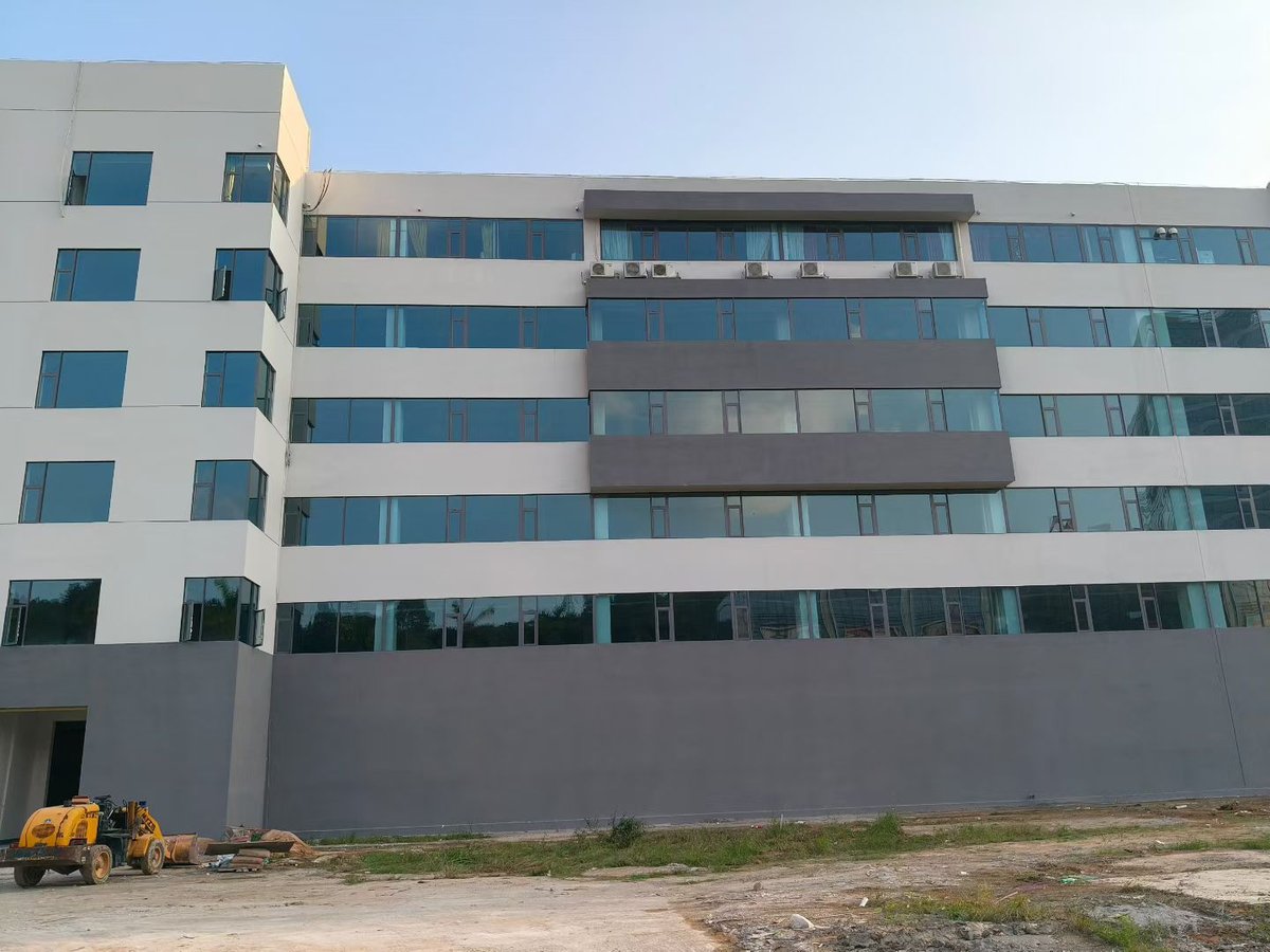 Five-storey factory and office building with continuous ribbon window bands